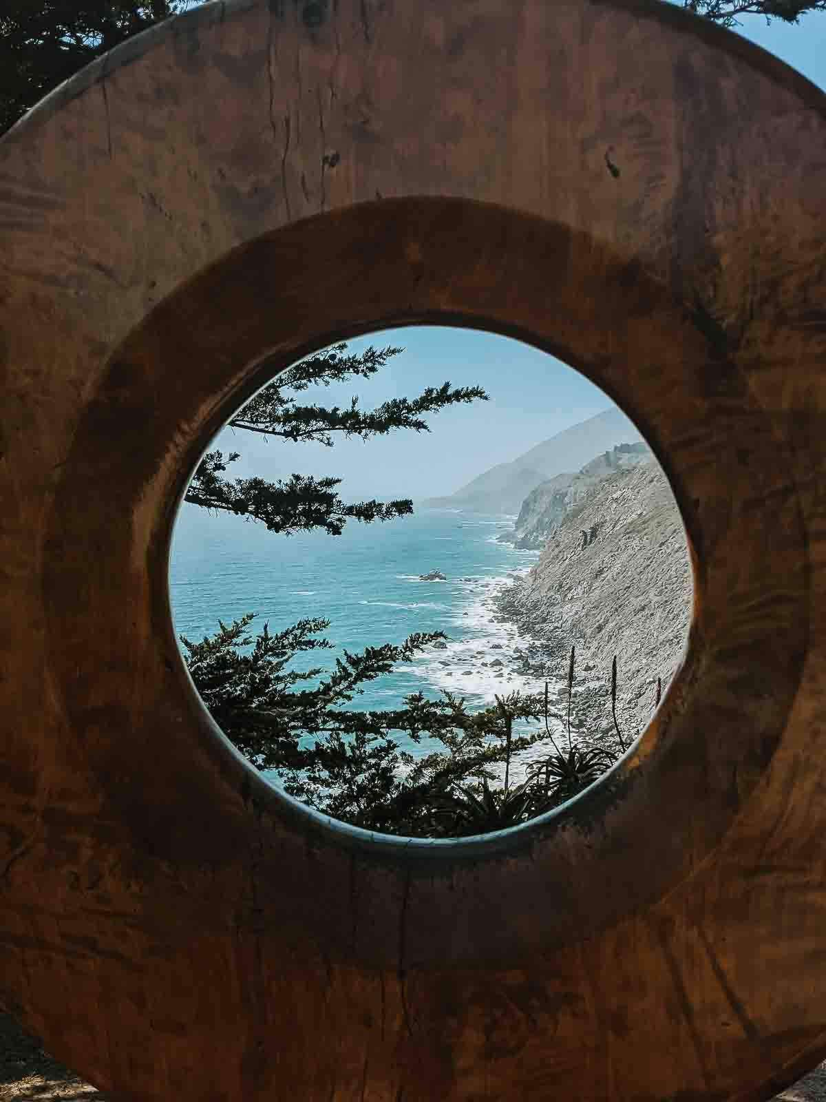 Big Sur view through wooden sculpture. 