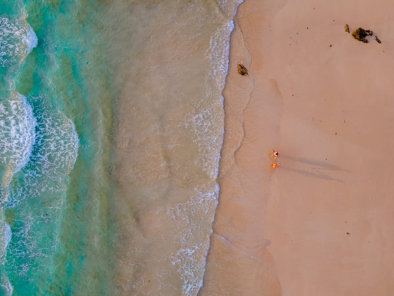 Drone shot of couple on the beach.