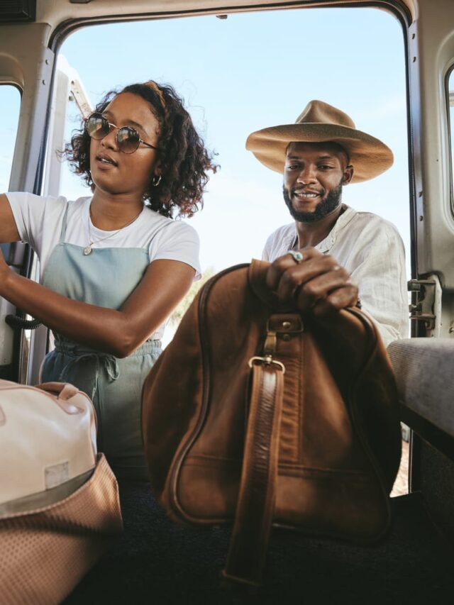 Couple putting bags in car for a romantic weekend getaway in Ashevillw, NC.