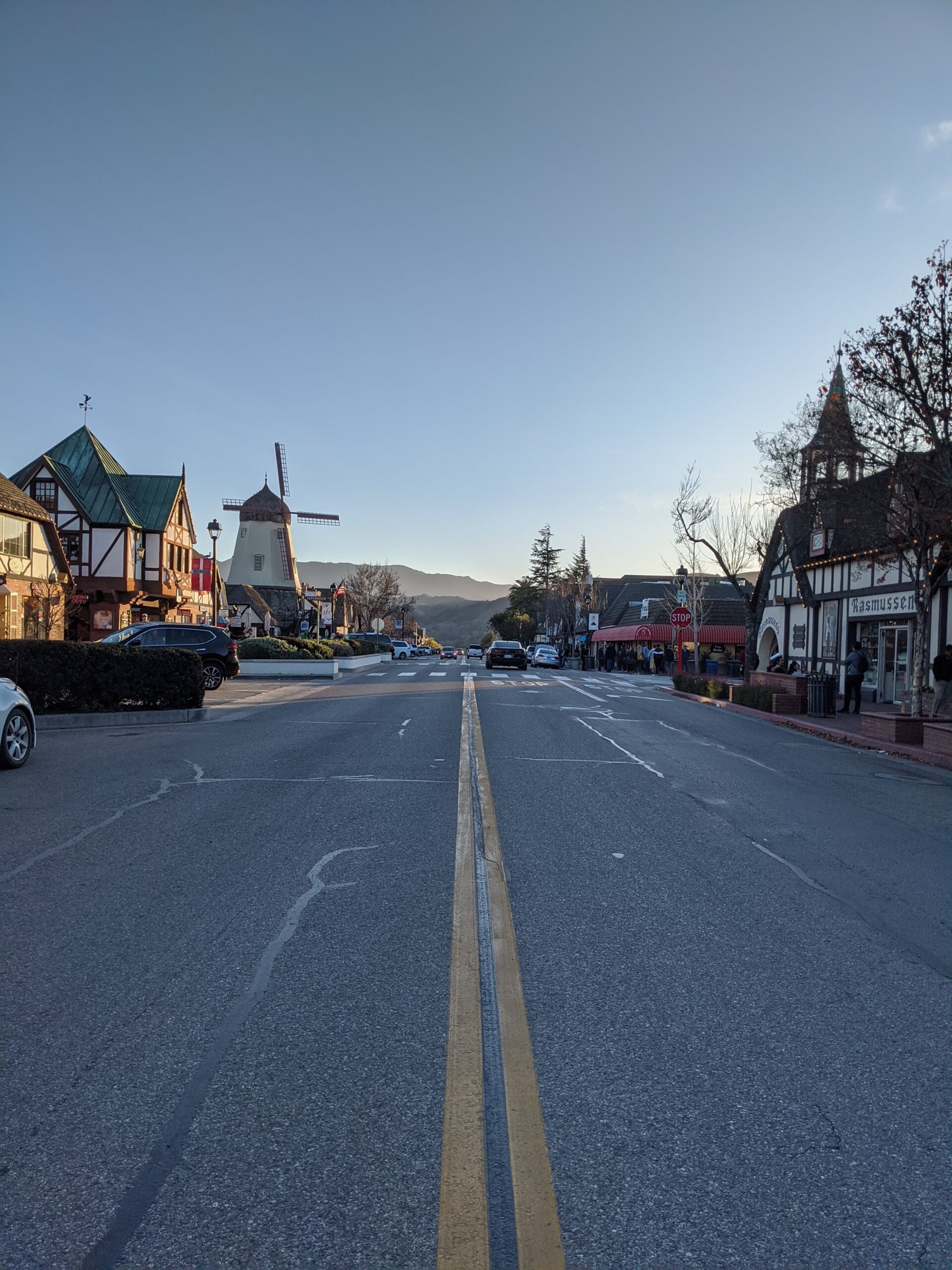 View of Solvang from the street with iconic windmill in the scene. 