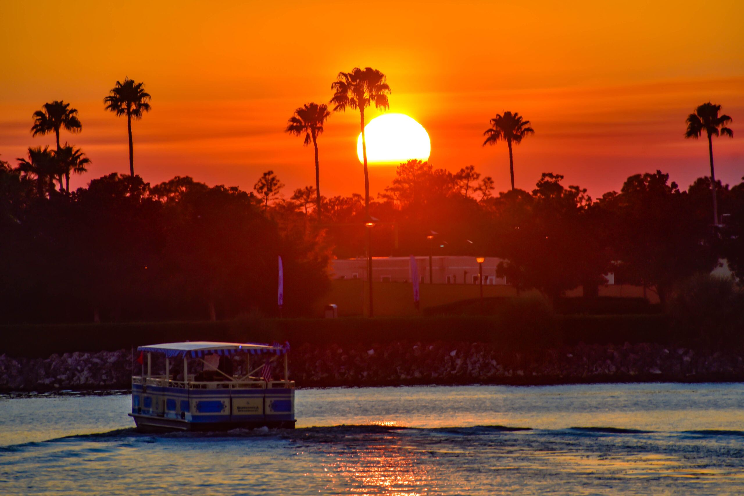View of water ferry at sunset in Disney World.