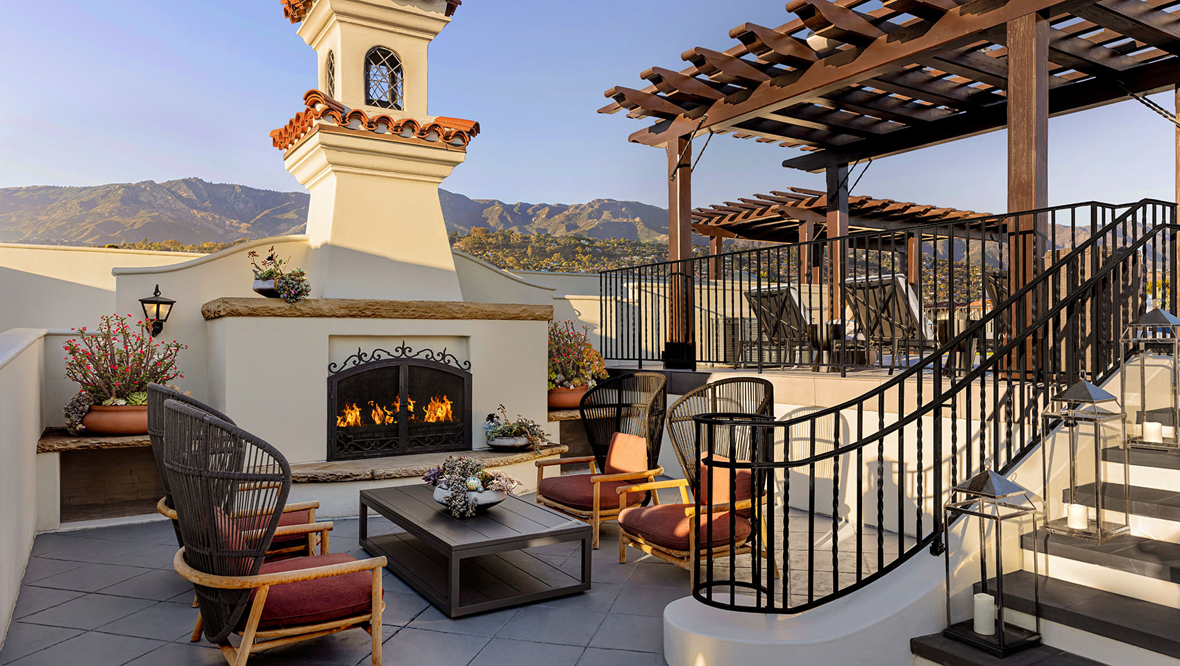 View of outdoor lounge area with fireplace at Canary Santa Barbara.