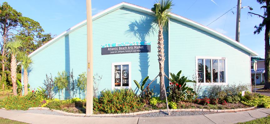 Exterior view of Atlantic Beach Arts Market with palm trees.