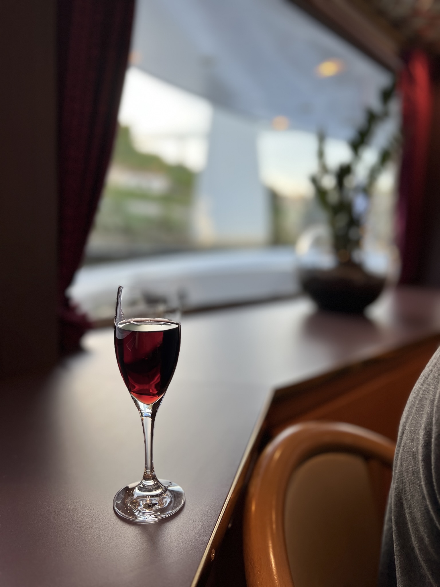 Red wine on countertop aboard a river cruise.