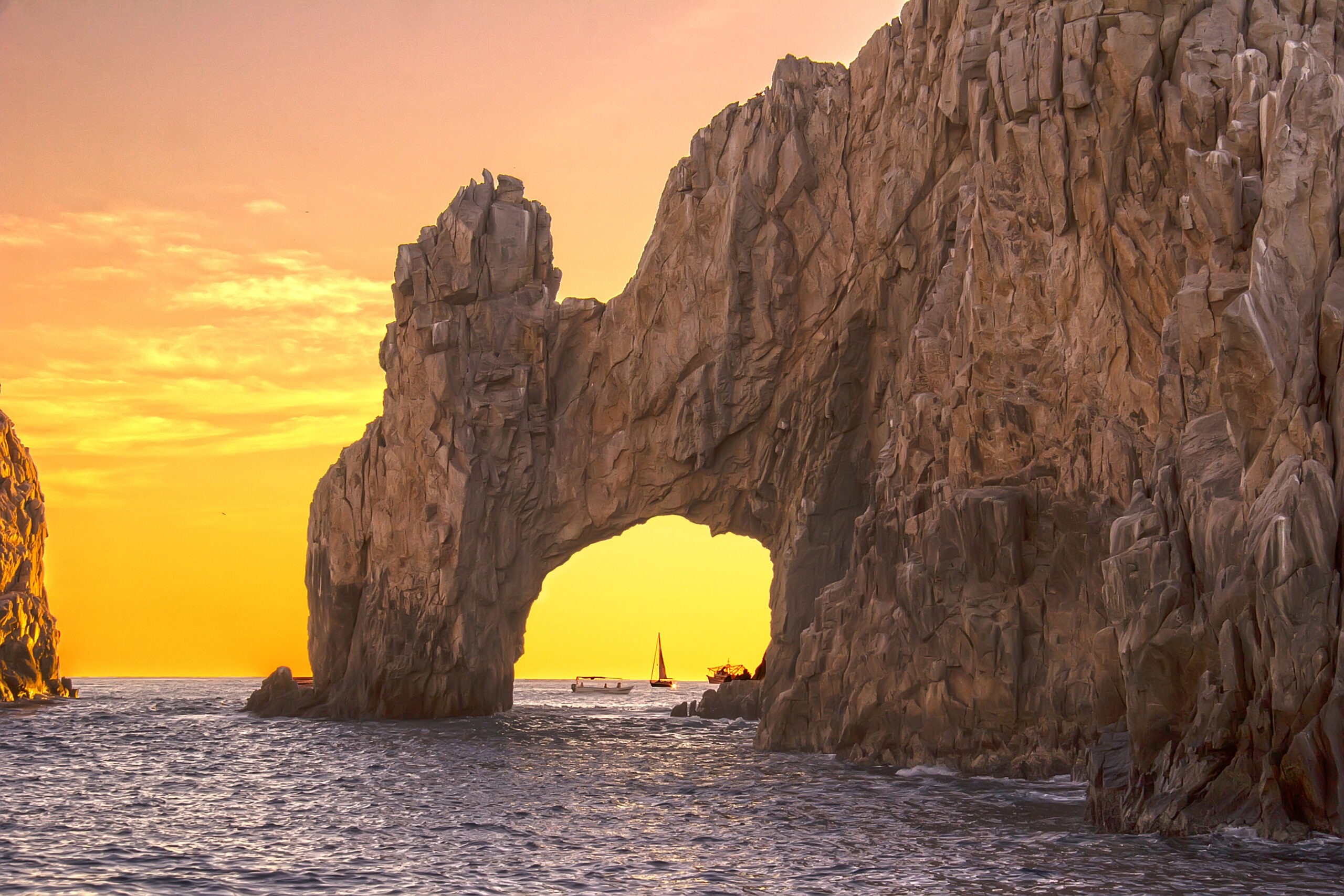 a picture of los cabos arch in a yellow sunset, water  color, blue, yellow, horizontal, location, daylight, nature