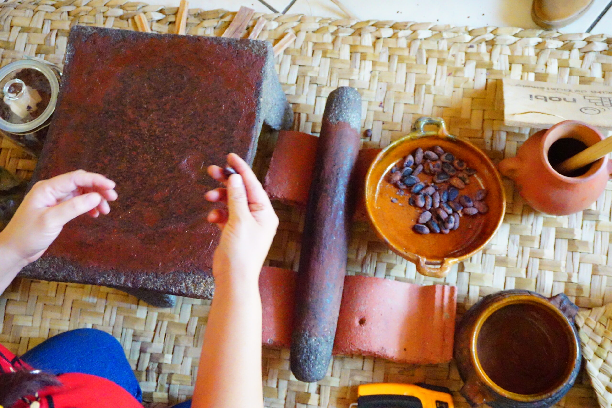 Ancient mayan chocolate making with metate grinding stone in Guatemala