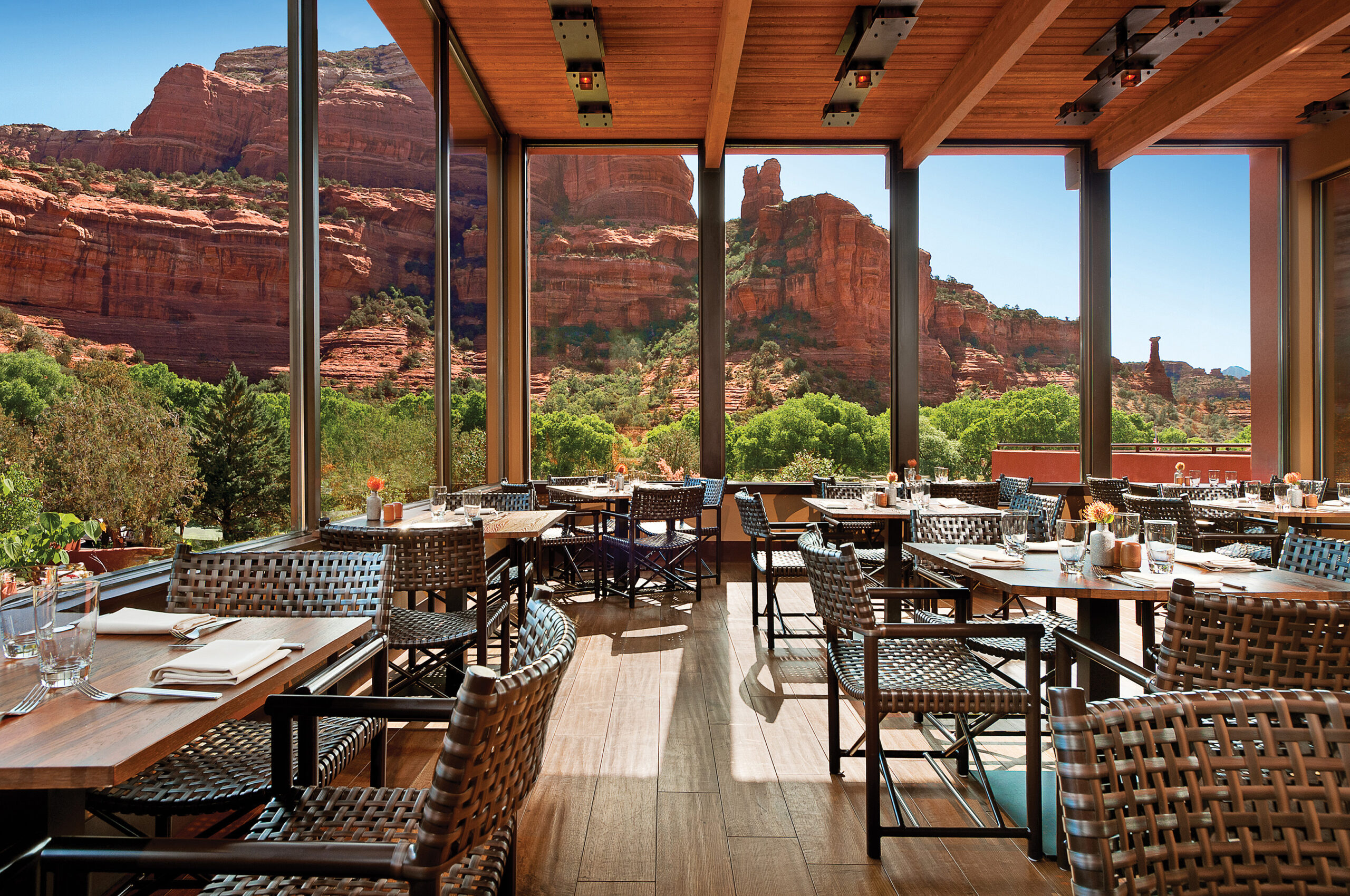 Dining room with floor to ceiling windows overlooking the Sedona red rocks.