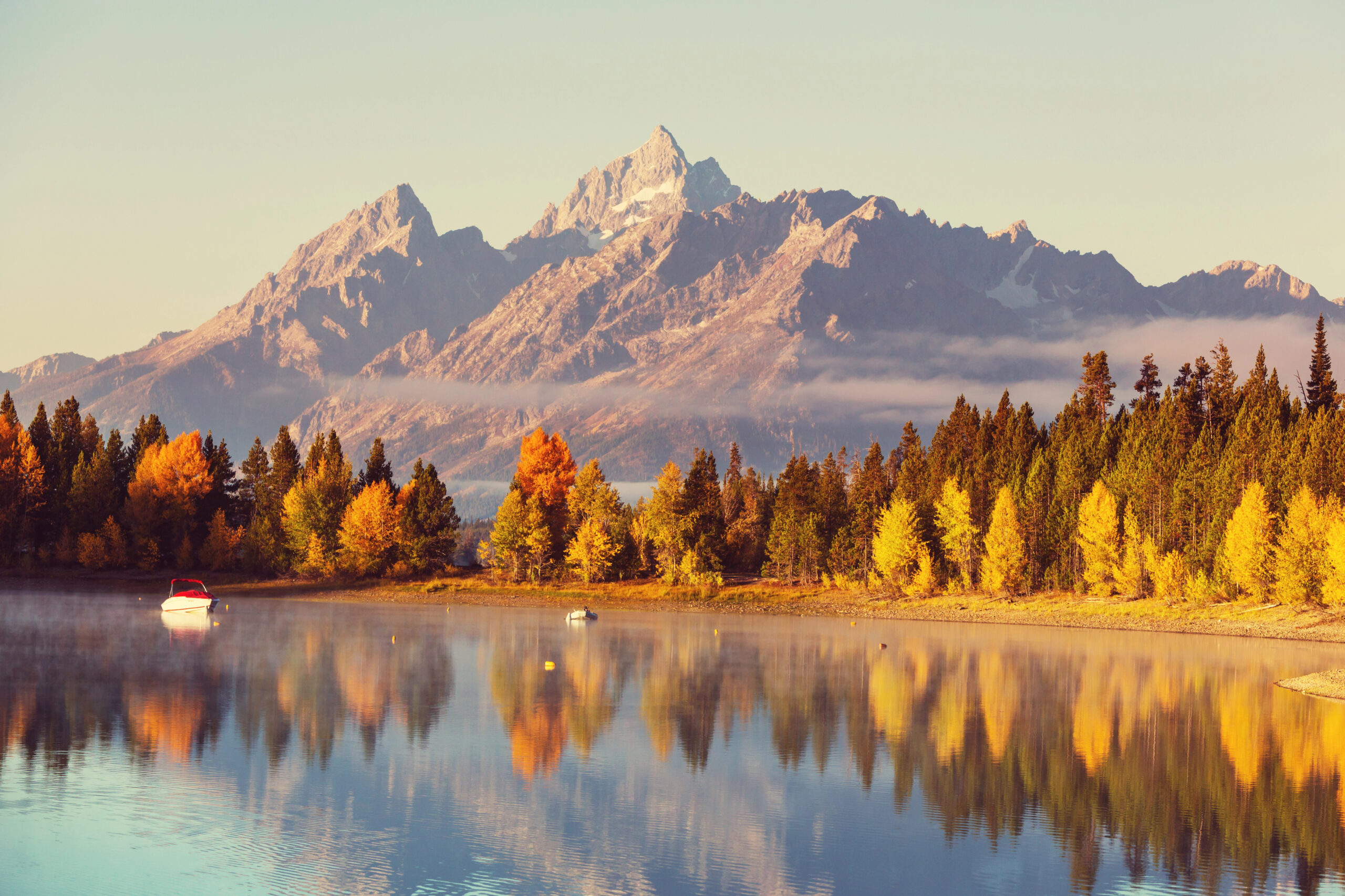 Scenic view of snow capped mountains in Grand Teton National Park, one of the best fall getaways for couples.