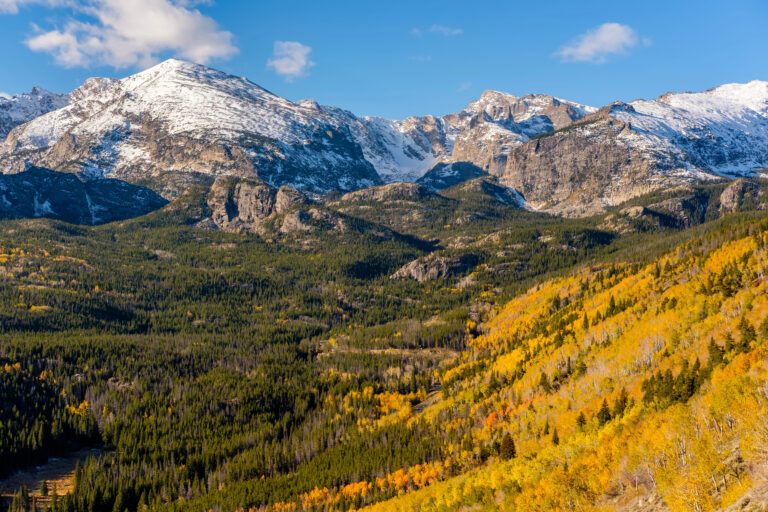 Snow capped mountain in Aspen forest, Colorado. It's one of the best fall getaways for couples!