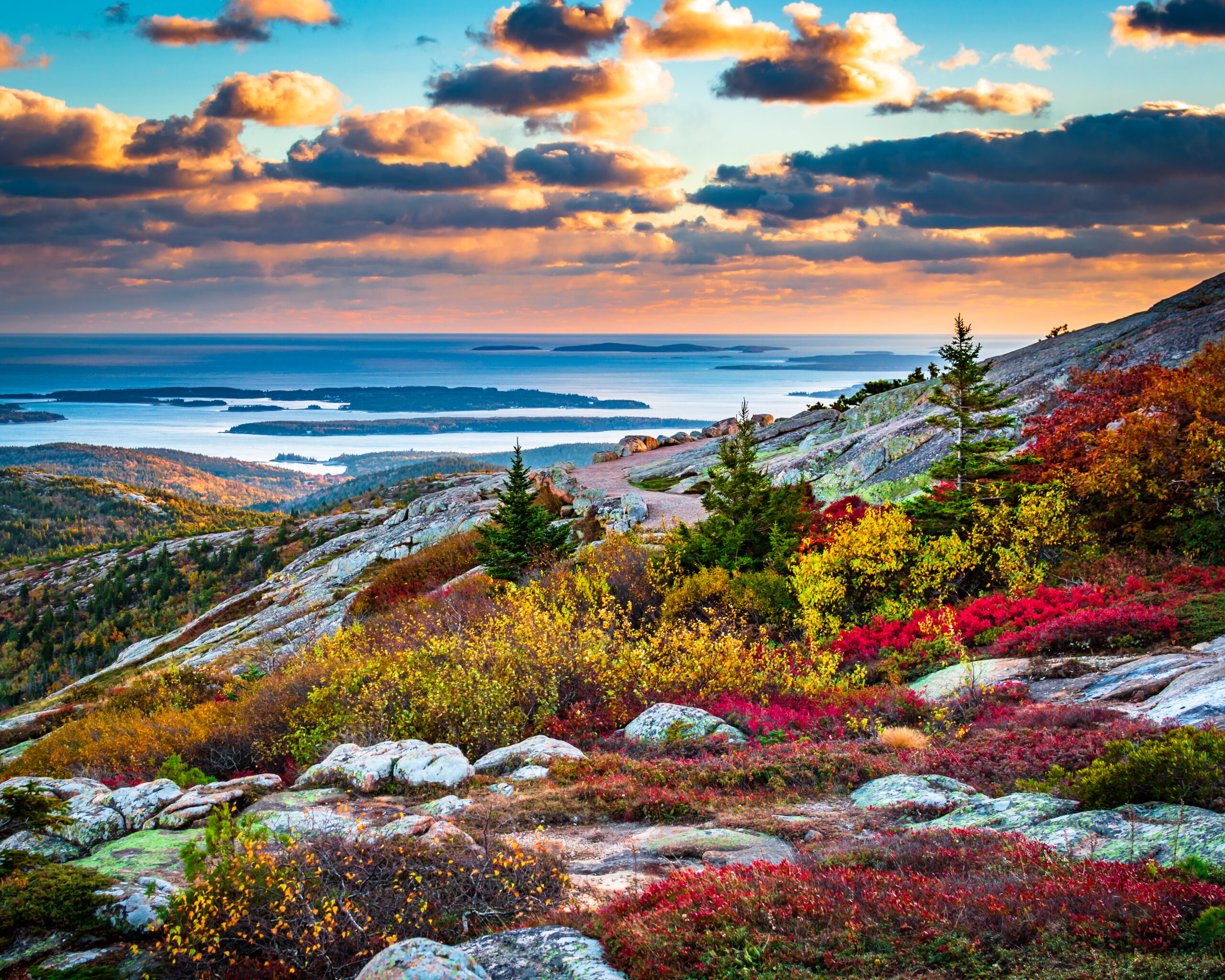 Autumn views of Acadia National Park at sunset, one of the most romantic getaways in the Fall. 