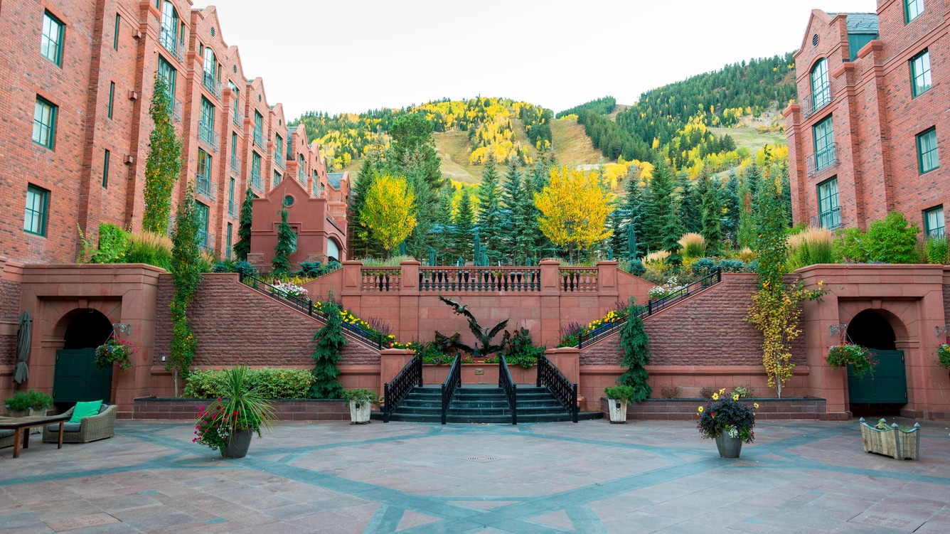 Exterior view of The St. Regis in autumn, one of the most romantic getaways in October.