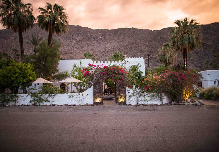 Korakia Pensione exterior at sunset, one of the most romantic getaways in November. 