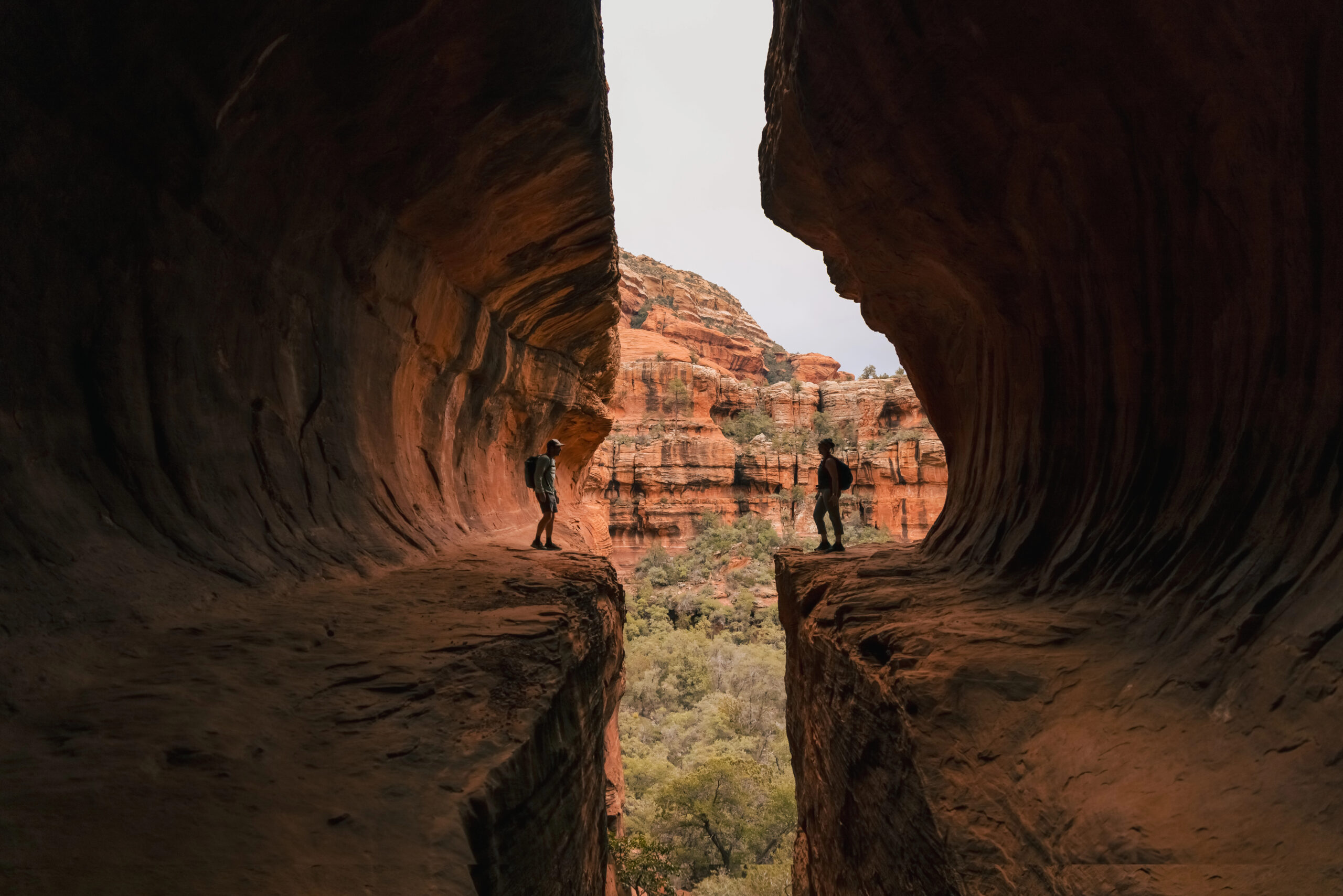 Couple in cave of Boynton Canyon Trail in Sedona, Arizona.