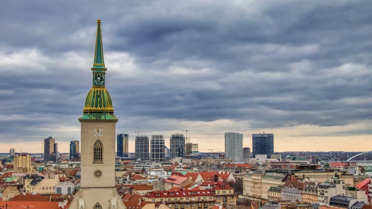 St. Martin’s Cathedral with modern skyline in Bratislava, Slovakia.