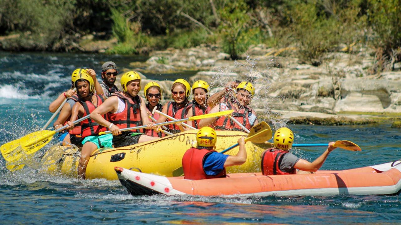 Couples rafting together on a river adventure