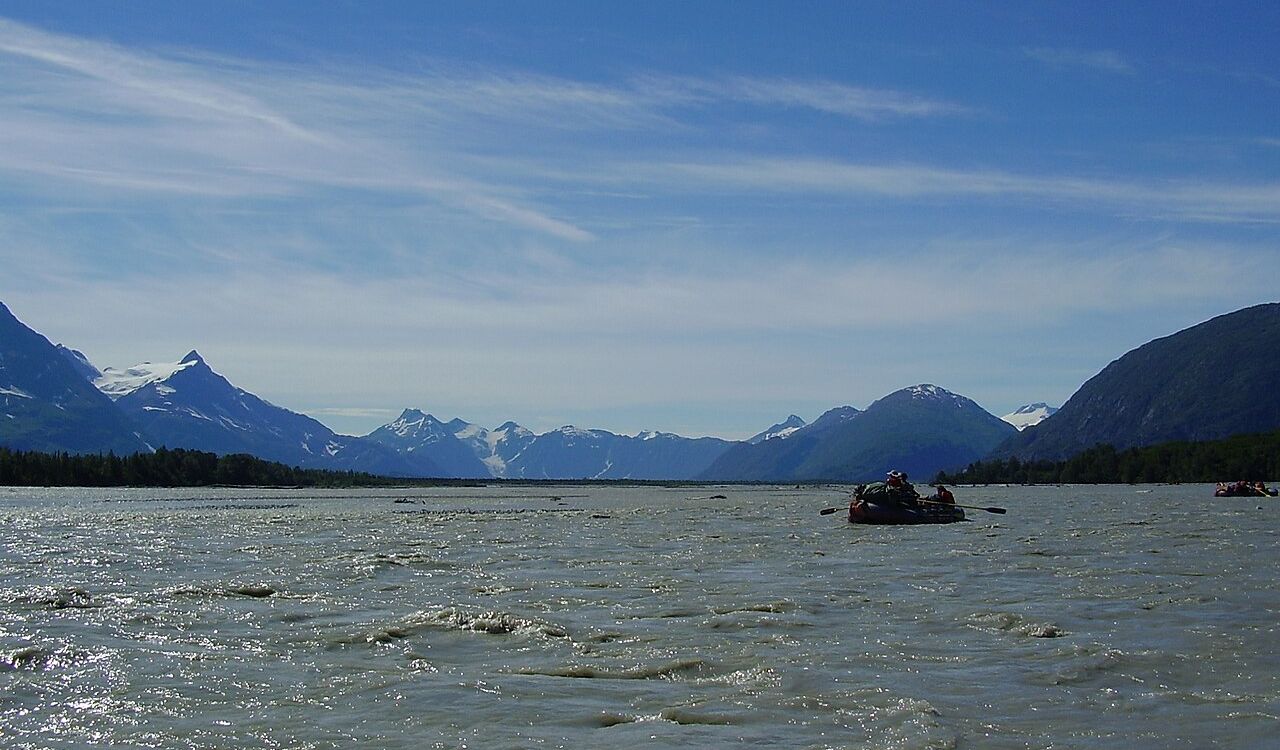 Rafting the Alsek River with glacier peaks in the background