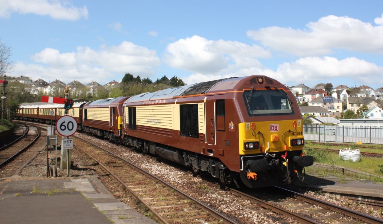 The British Pullman luxury train passing through a quaint English town