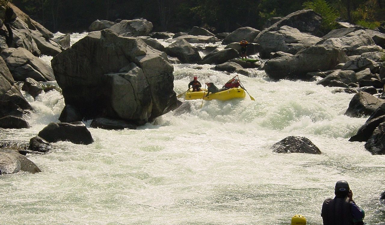 Rafters navigate intense whitewater and boulders on Cherry Creek
