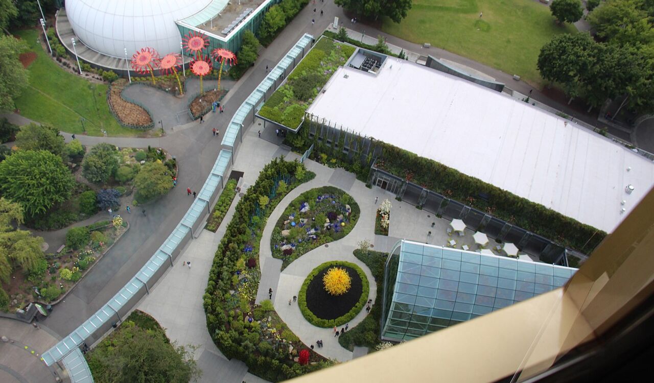 Aerial view of Chihuly Garden and Glass in Seattle, showcasing its vibrant sculptures and lush landscaping