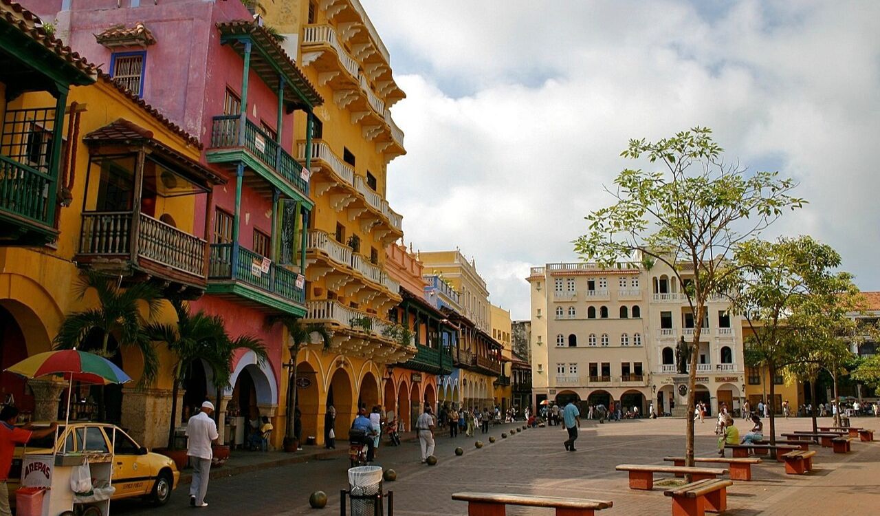 Colorful balconies overlook Cartagena's peaceful square