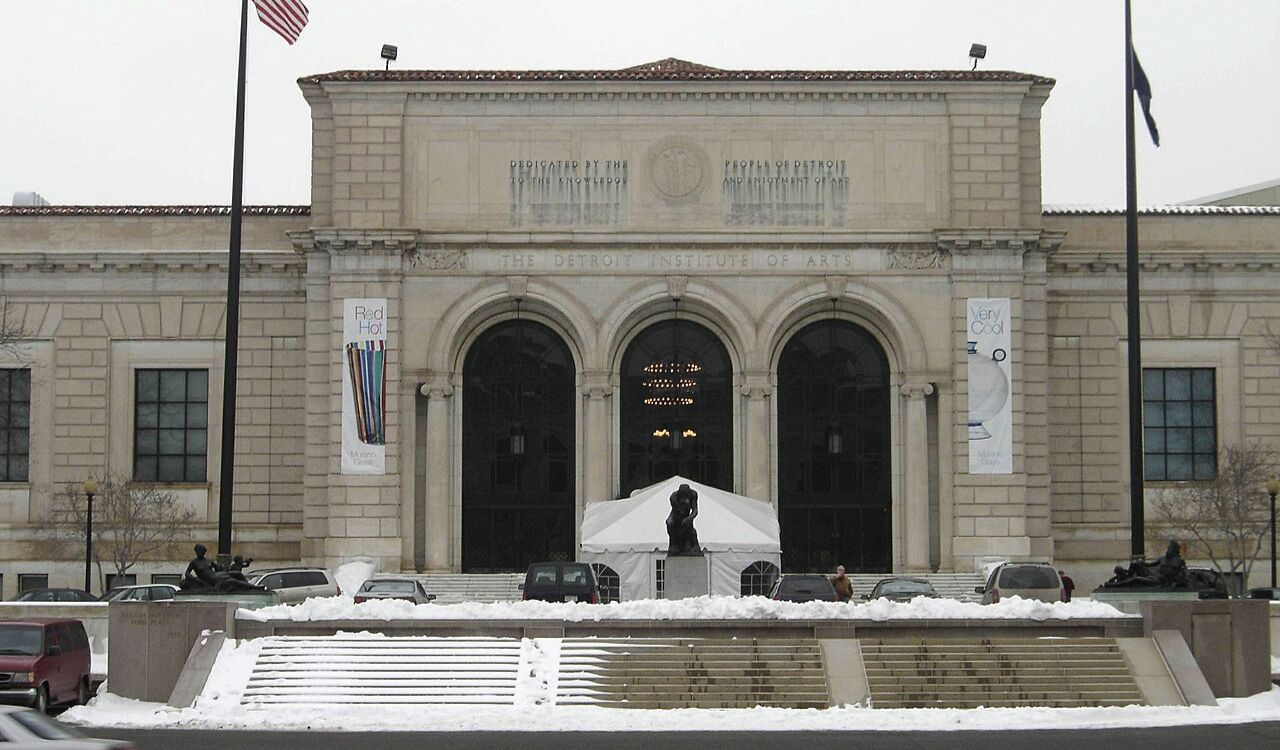 Detroit Institute of Arts entrance in winter with snow and statue out front