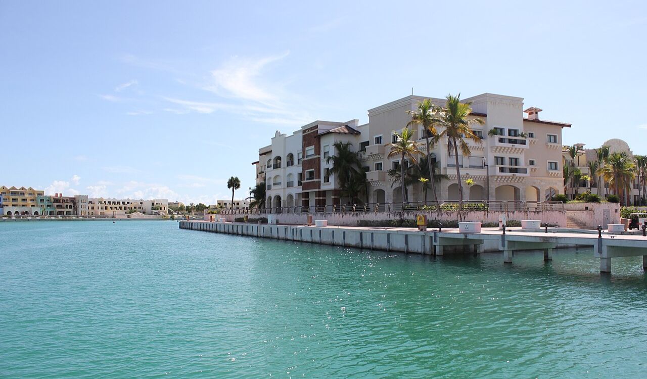 Calm waters meet charming coastal architecture