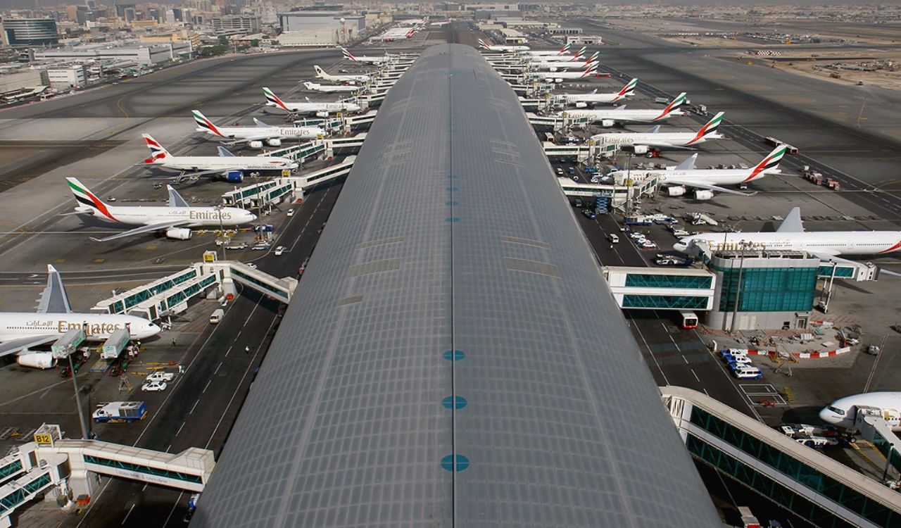 Terminal view of Dubai International Airport (DXB) with Emirates aircraft