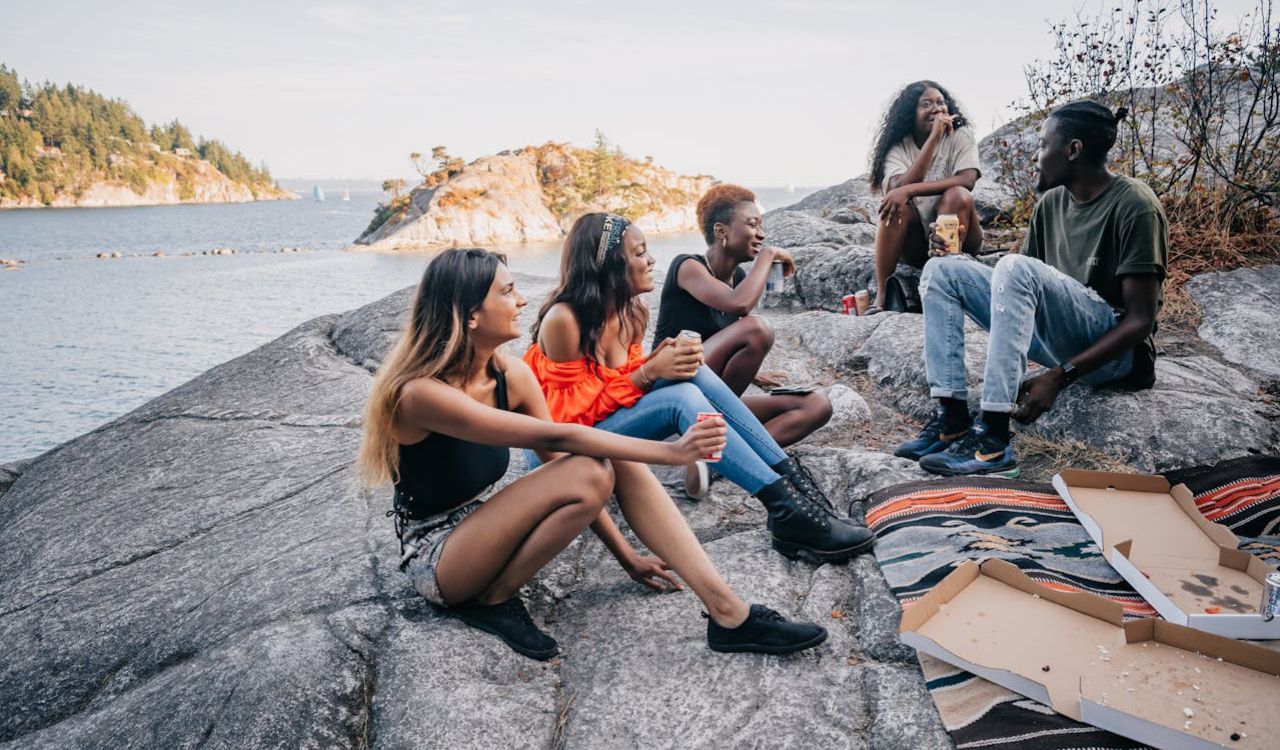 Friends enjoying a laid-back picnic on scenic Margaret Island