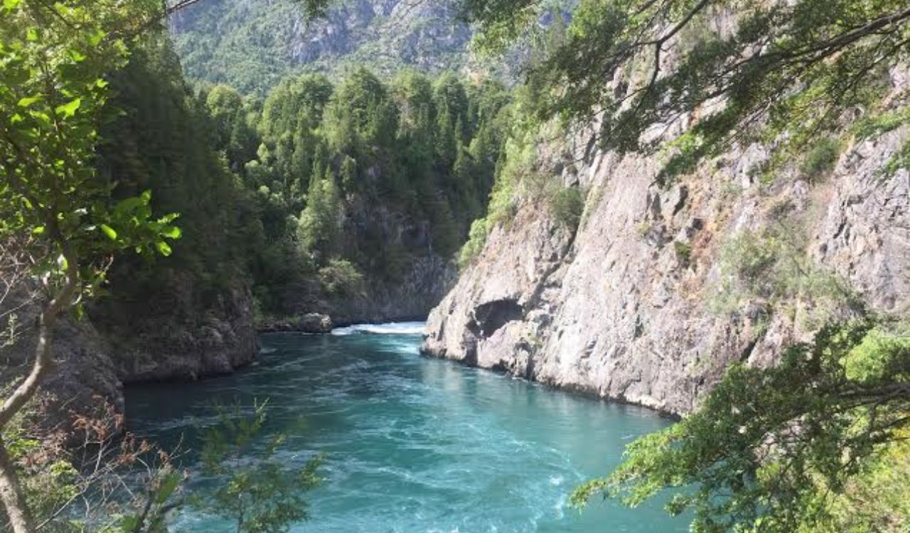 Futaleufú River canyon with clear blue water and forested cliffs