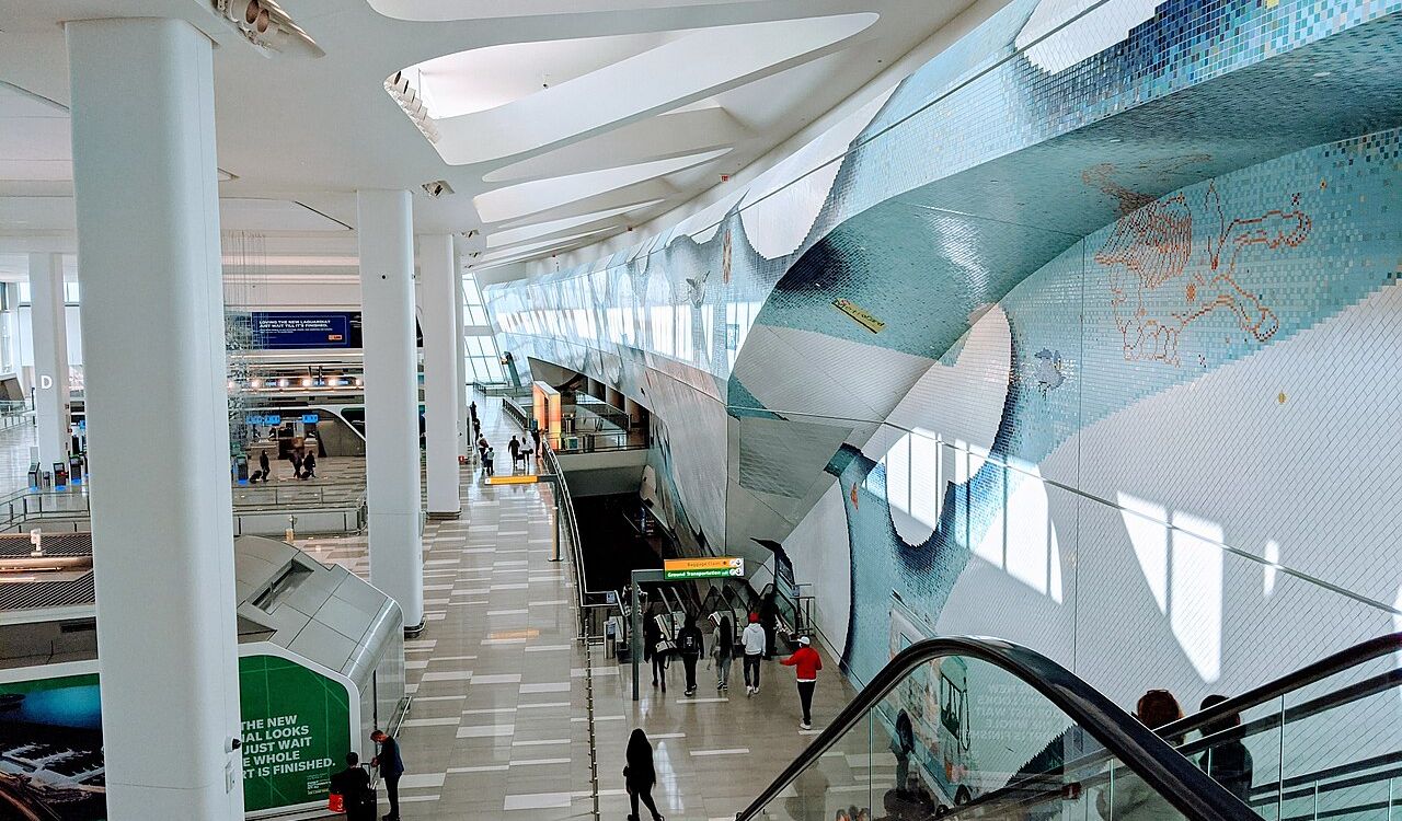 Interior of LaGuardia Airport (LGA) in New York with modern design and mural