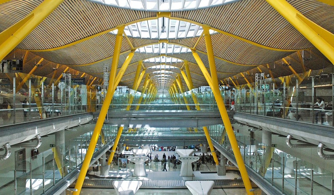 Madrid-Barajas Airport interior with yellow beams and glass walls