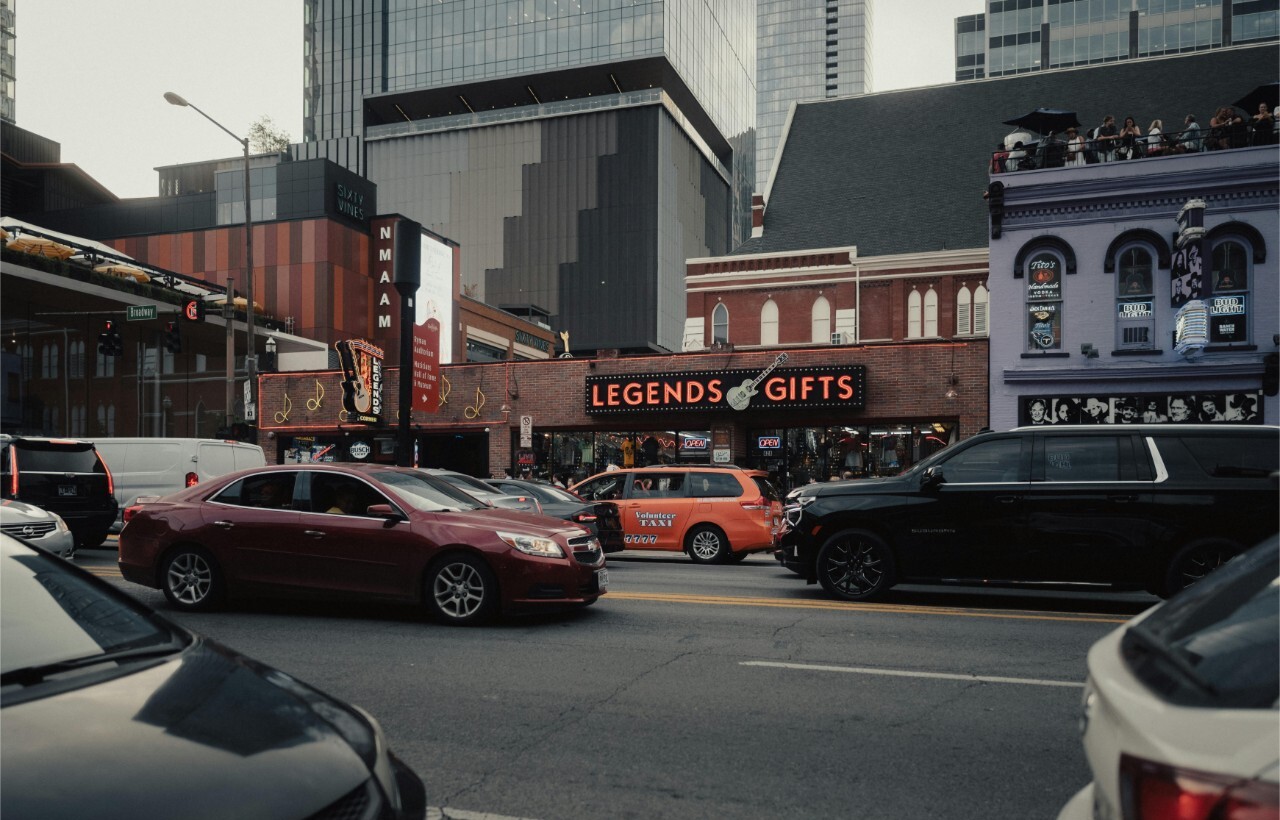 Broadway street traffic and gift shops in Nashville.
