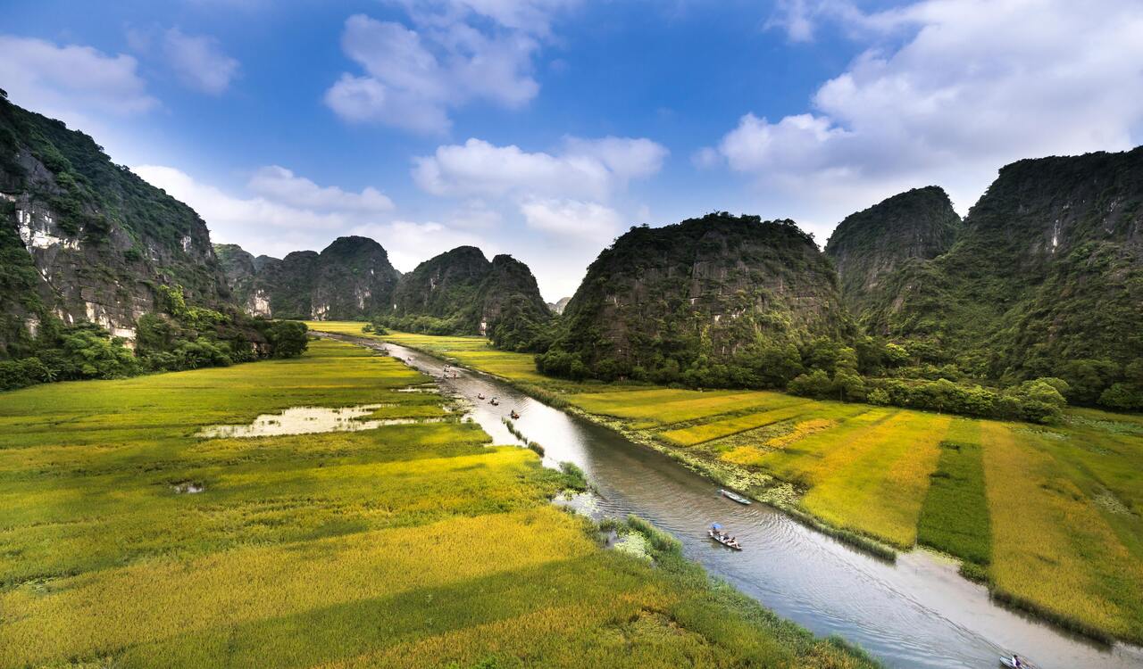 Boats on River Near Mountains