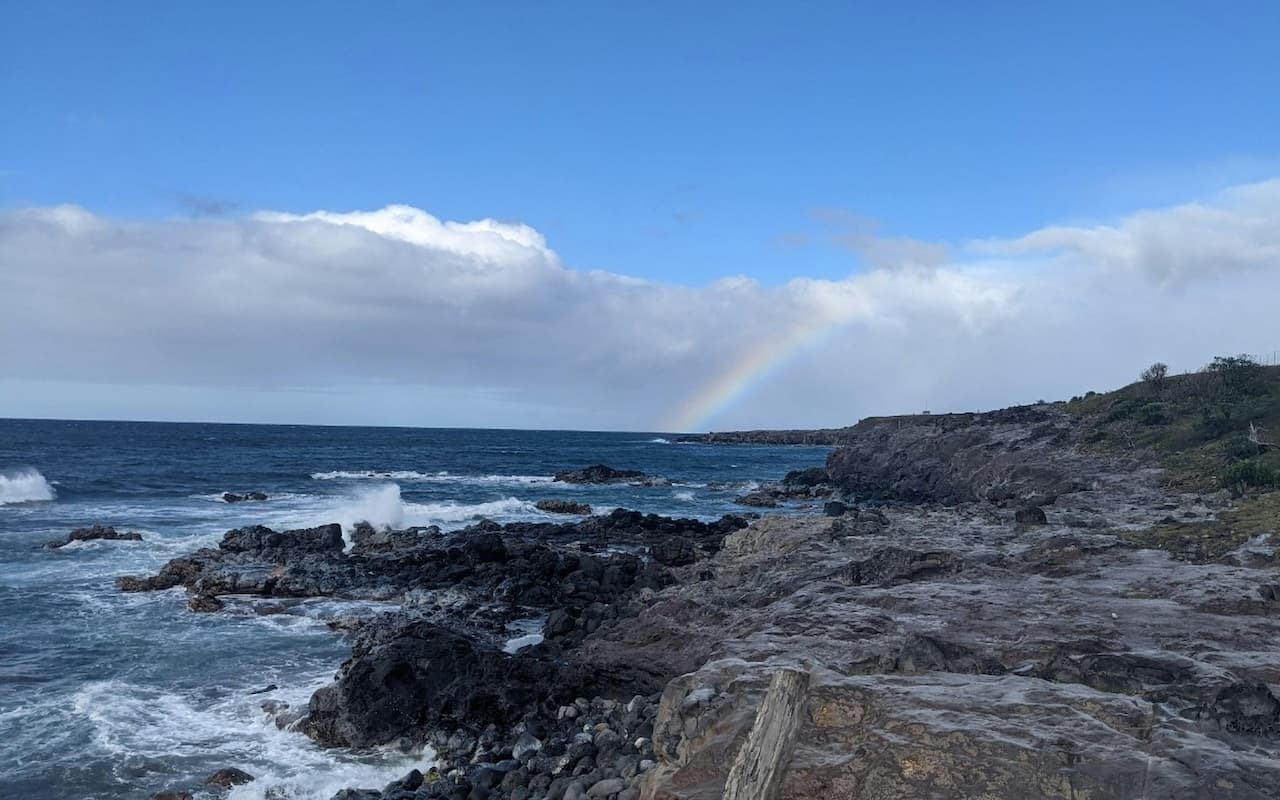 ChatGPT said:
Rocky coastline with crashing waves and a rainbow in Paia, Maui, Hawaii.