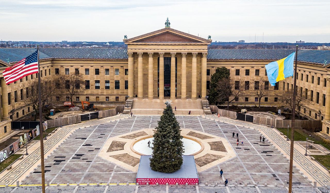 Front view of the Philadelphia Museum of Art with a holiday tree in the plaza