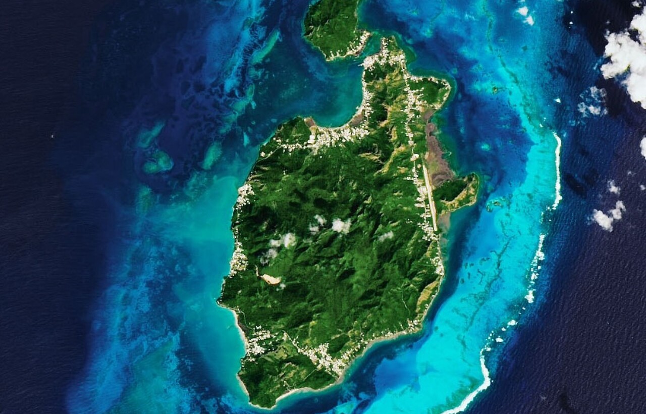 Aerial view of Providencia Island, Colombia, surrounded by coral reefs.