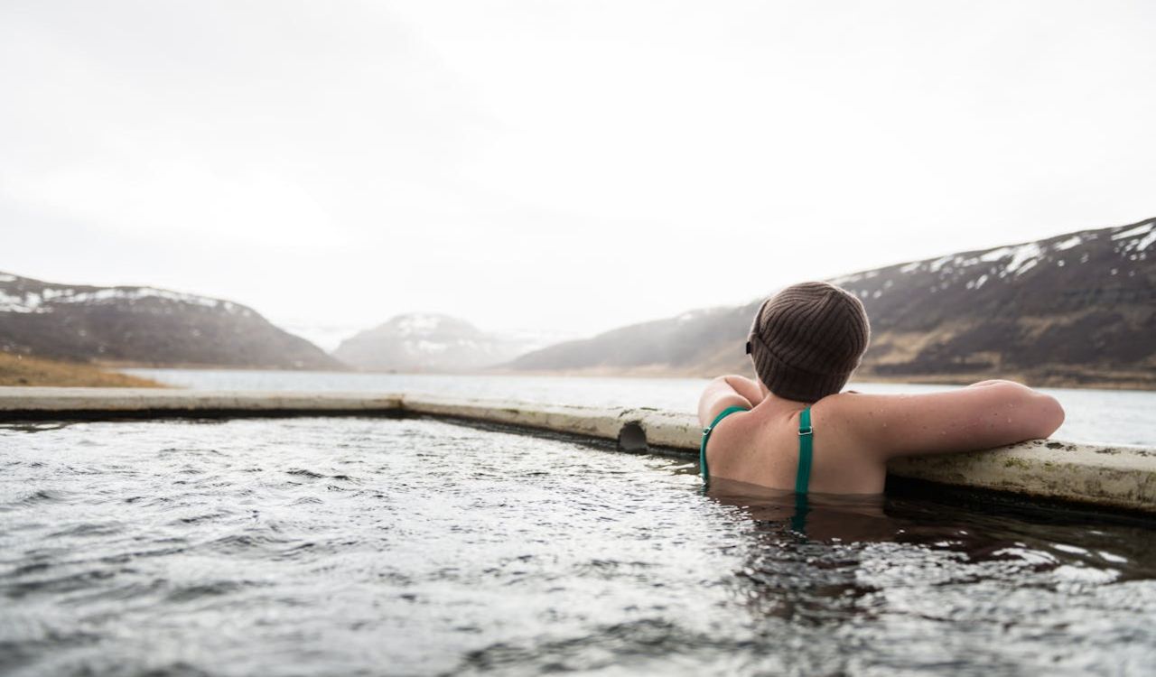 Relaxing in a thermal bath with mountain views.
