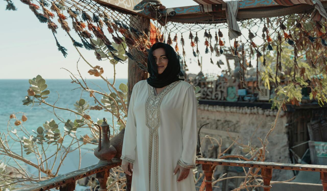 A Woman in White Long Sleeve Dress