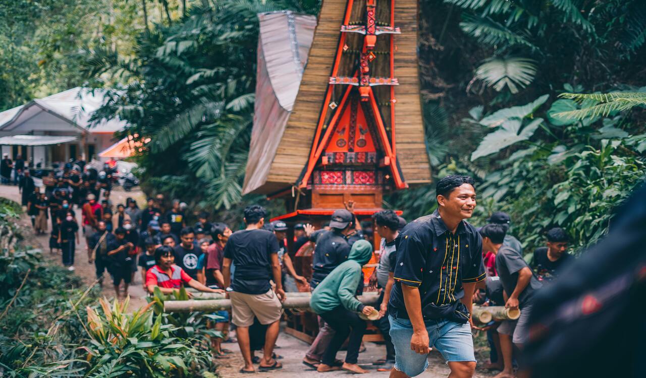 Traditional Funeral Procession in Lush Forest