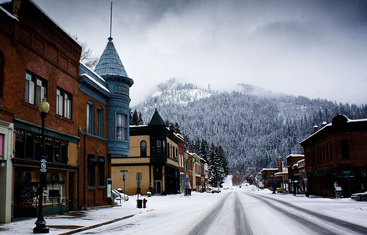Snow-covered street and historic buildings in Wallace, Idaho.