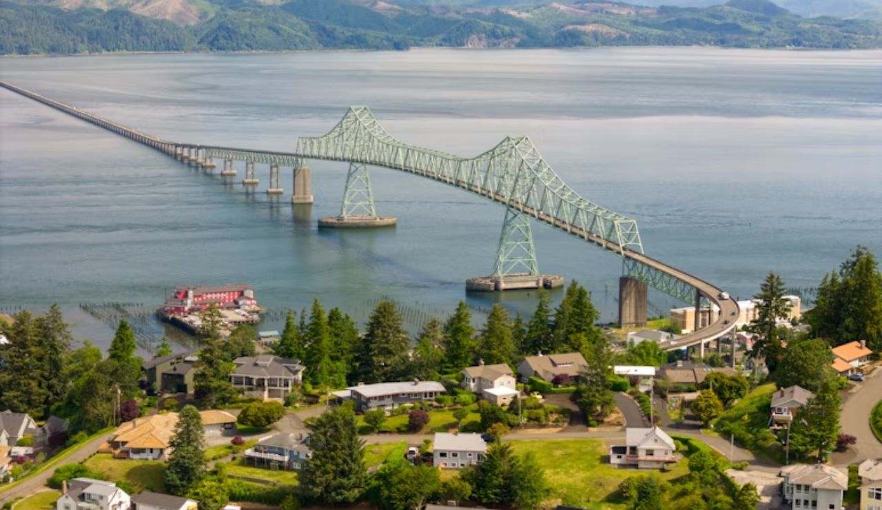 Astoria-Megler Bridge over the Columbia River with homes in Astoria, Oregon.