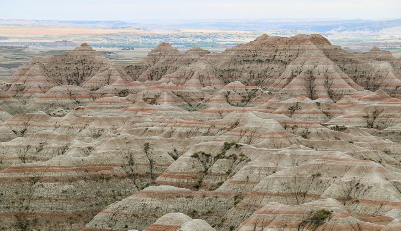 Striped rock formations and rugged terrain at Badlands National Park, South Dakota.