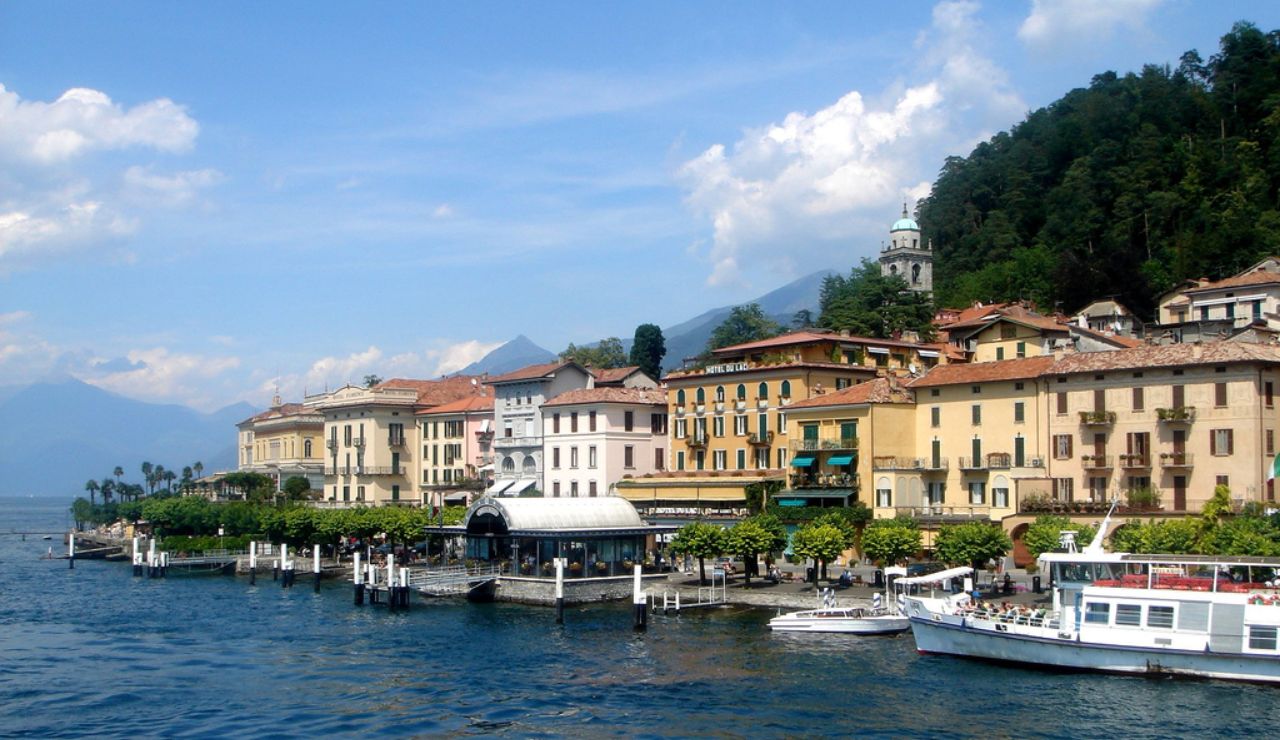 Colorful waterfront buildings and boats in Bellagio, a charming town on Lake Como, Italy.