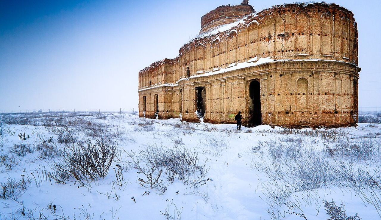 Abandoned Chiajna Monastery near Bucharest, Romania, in a snowy landscape.