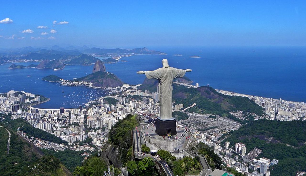 The iconic Christ the Redeemer statue overlooks Rio de Janeiro and its coastline from atop Corcovado Mountain.