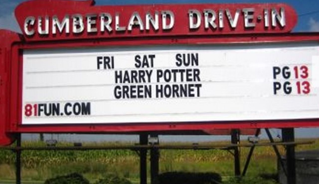 Cumberland Drive-In Theatre marquee sign showing Harry Potter and Green Hornet, both rated PG-13, with showtimes listed for Friday through Sunday.