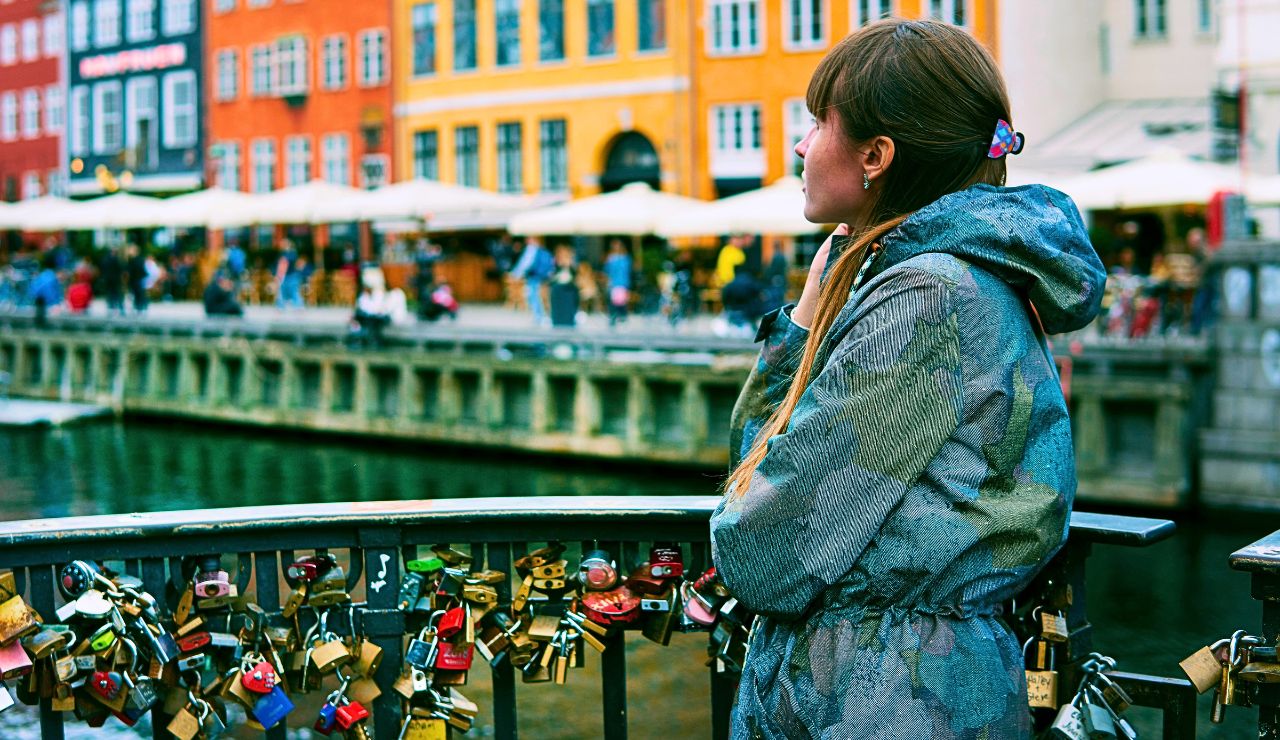 Bright canal-side buildings and bicycles in Copenhagen.