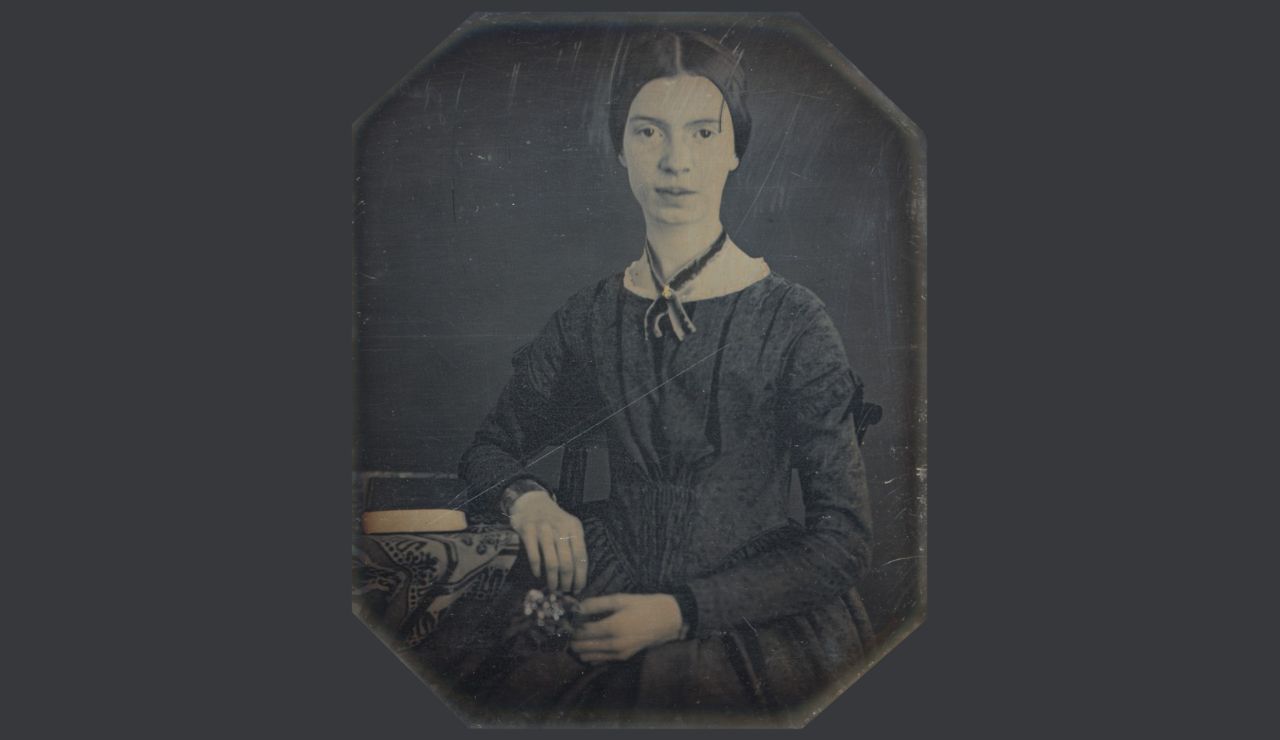 Emily Dickinson alone, her face quiet and pensive, eyes filled with unspoken emotion.