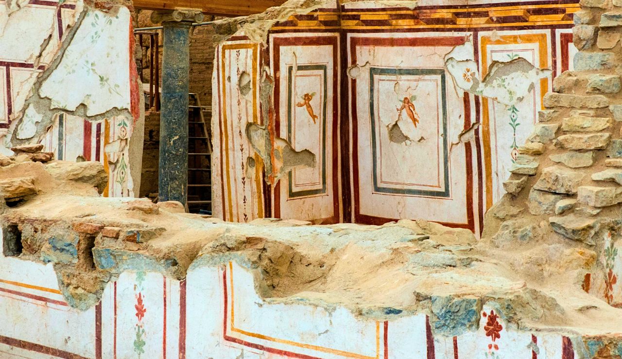 Preserved Roman mosaics and interior walls inside ancient homes