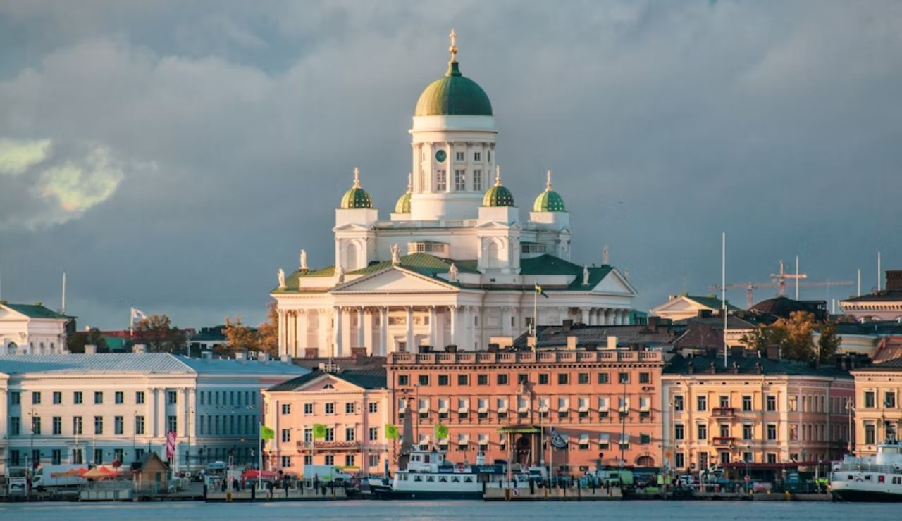 View of Helsinki Cathedral and colorful waterfront buildings in Helsinki, Finland.